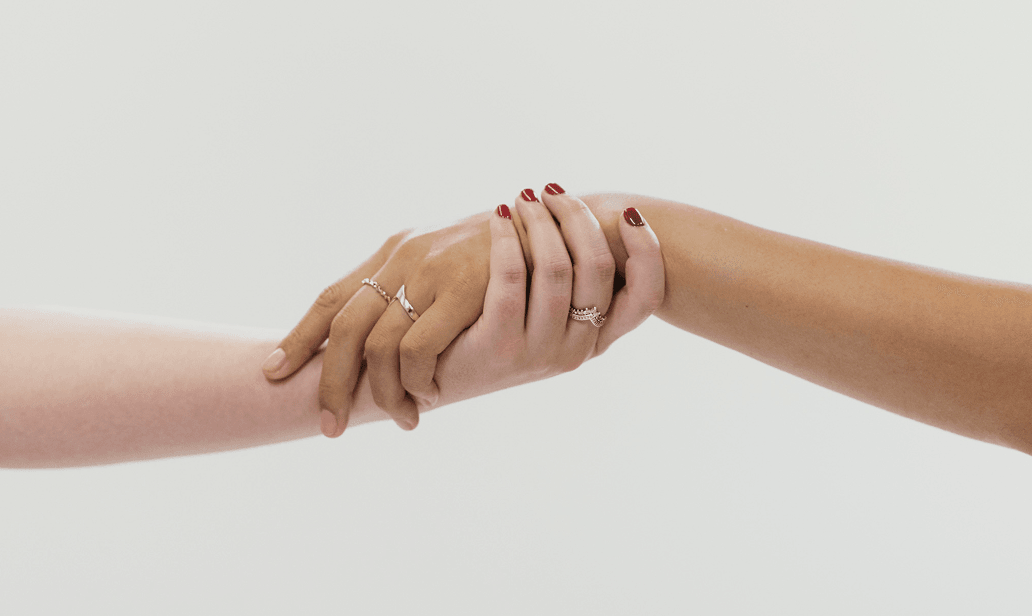 Hands reaching together